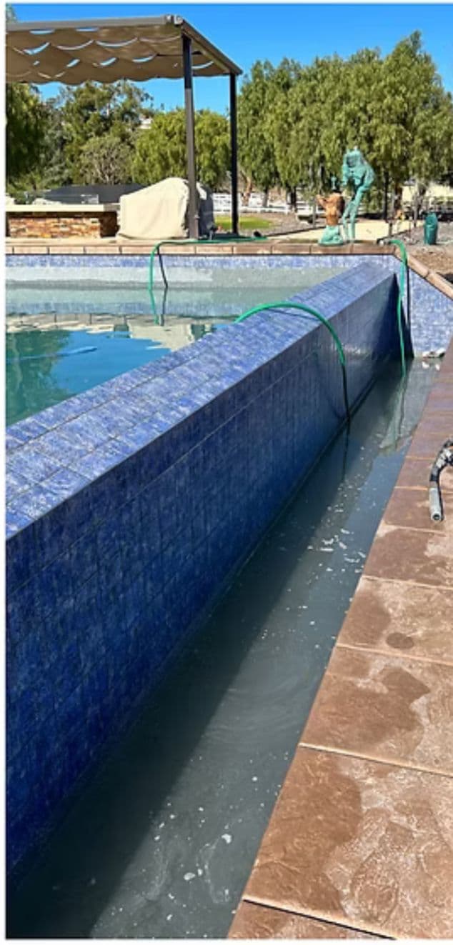 Deep blue pool tile fully restored after calcium blasting by Window Wizards in Los Angeles
