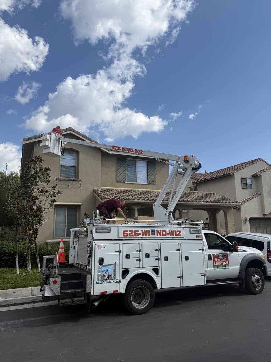 Window Wizards installing holiday lights on a two story home near Bellflower