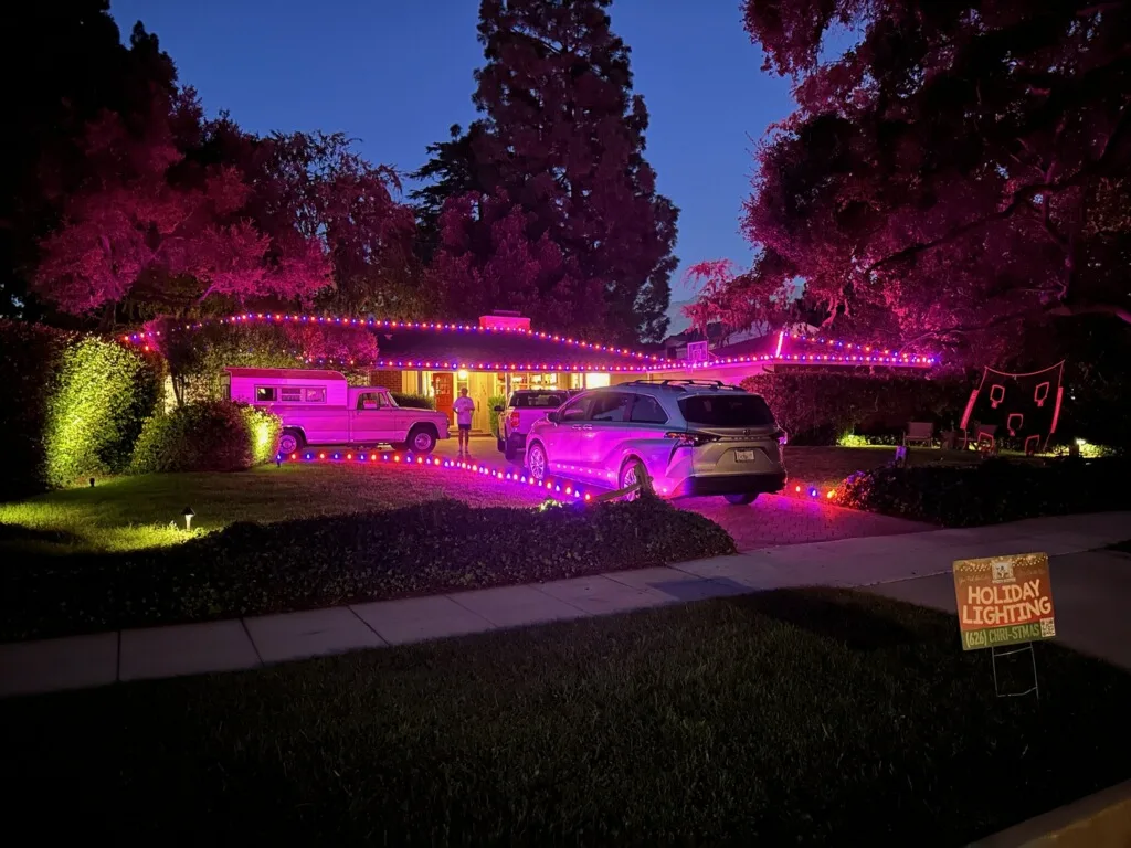 Ranch home with RGB Christmas lighting and 626 Christmas service truck on-site