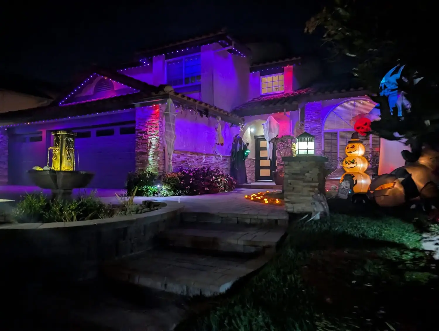 Permanent lights set purple and orange for Halloween on a home in the San Gabriel Valley & LA — installed by 626 Christmas